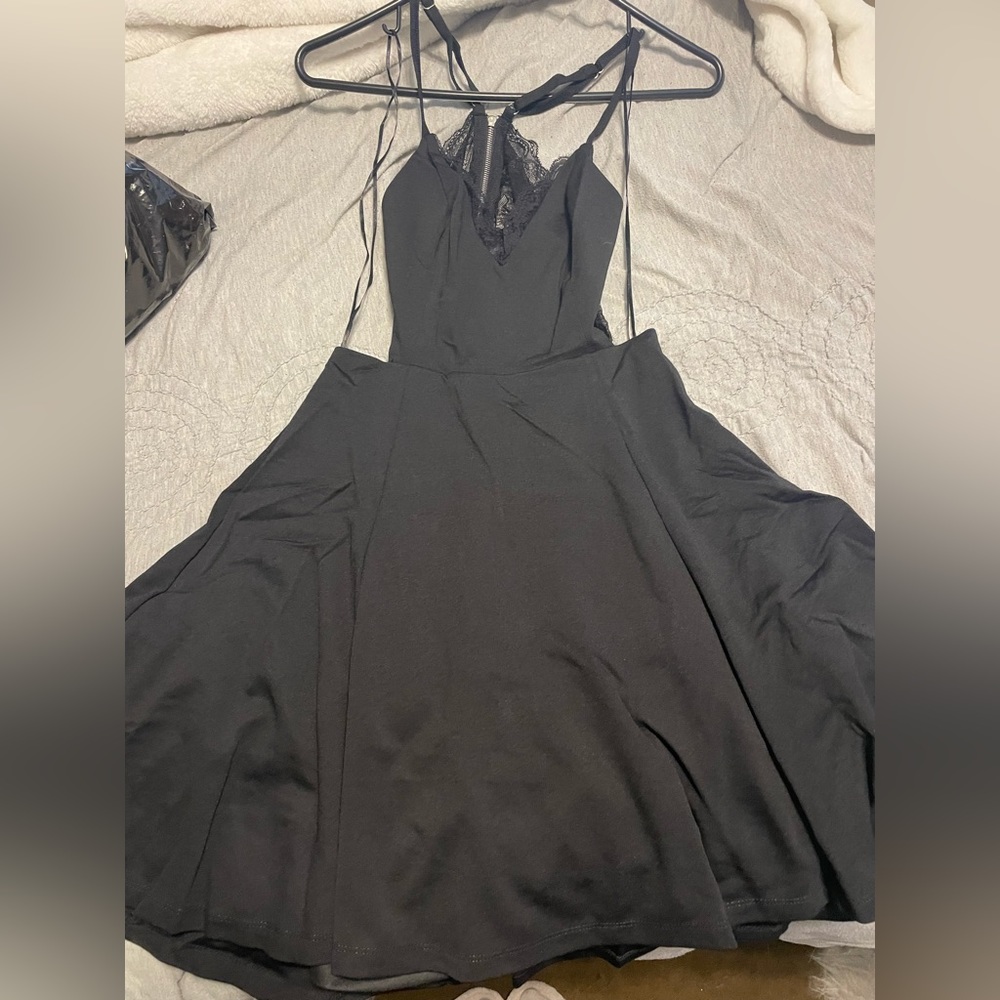 Lulu Short Black dress with Lace open back. Small